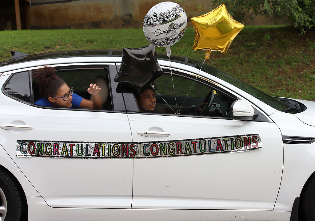 Family and friends wish Jasmine-Kay Johnson congratulations during a parade on Saturday in Alton, Illinois